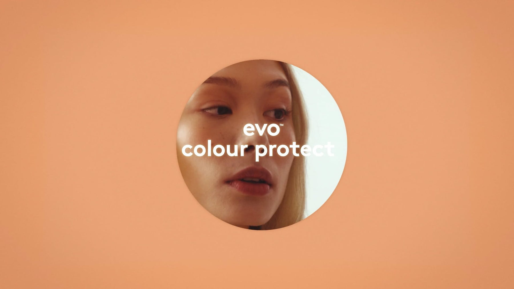 Circular inset of a person's face with 'evo colour protect' text on an orange background